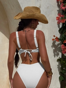 Detailed back view of white ribbed two-piece bikini with lace-up ties and high waist