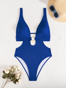 Blue ribbed one-piece swimsuit featuring side cut-outs and a central gold ring detail