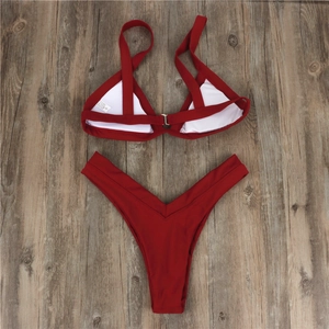 Detailed flat lay of burgundy high waist bikini with halter top and padded cups
