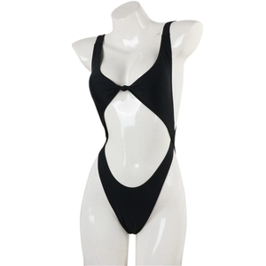Detail of black one-piece swimsuit featuring front knot and sexy waist cut-out design