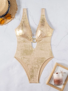 Detail of champagne gold metallic foil swimsuit featuring a V-neck and gold ring buckle