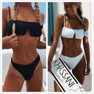 Two-piece bikini set with V-cut bandeau top and high-leg bottoms in black and white