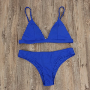 Detail of royal blue bikini top with silver metal ring and premium elastic fabric
