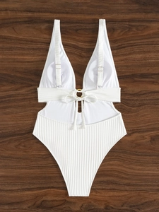 Detailed view of white ribbed one-piece swimsuit with metal ring and adjustable back straps