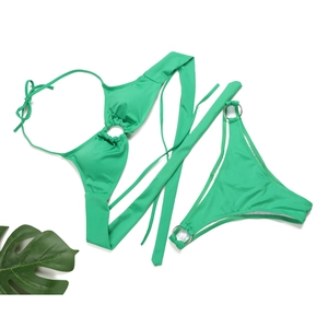 Detail of bright green bikini featuring silver metal rings and textured ribbed fabric