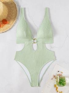Detailed view of light green ribbed one-piece swimsuit with V-neck and gold ring detail