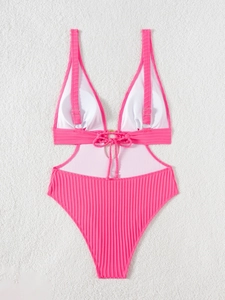 Flat lay of rose pink ribbed one-piece swimsuit with waist cut-outs and golden rings