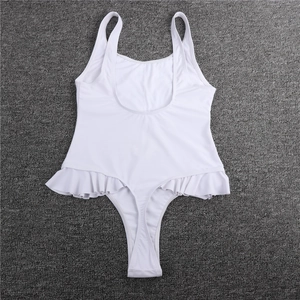 Detail of white one-piece swimsuit featuring a deep scoop back and ruffle trim on the sides