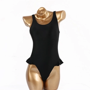 Detail view of black one-piece swimsuit with ruffle waist and high-cut leg on mannequin