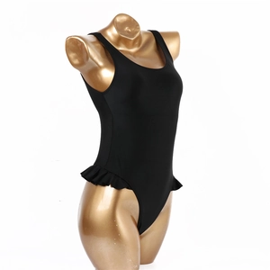 Close-up of black one-piece swimsuit with ruffle details and smooth elastic fabric