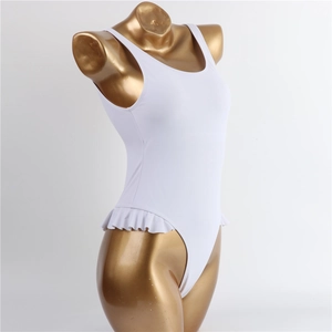 Detail of white one-piece swimsuit featuring elegant ruffled hip trim and wide straps