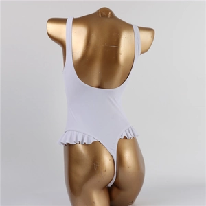 Back view of a white one-piece swimsuit with ruffle trim and an open-back design