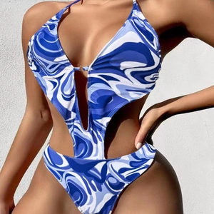 Detail view of blue marble print monokini with side cut-outs and metal ring buckle