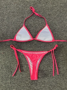 Detail view of hot pink bikini with removable padding and adjustable side ties