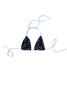 Detail of polka dot bikini top with adjustable neck ties and small decorative bows