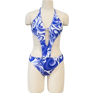 Detailed view of cutout blue marble print monokini swimwear with halter neck design