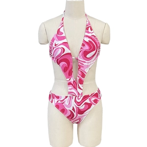 Detail of pink marble print one-piece swimsuit featuring halter V-neck and waist cut-outs