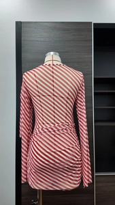 Detail of red and white striped mesh dress with ruched design and slim fit style