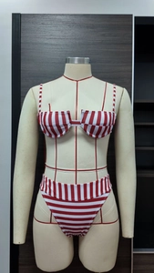 Detail view of red striped bikini top with cutout front and underwire support
