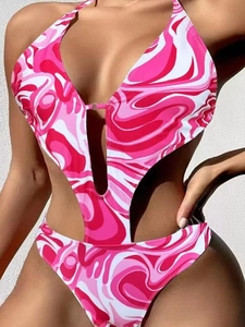 One-piece pink and white marble print swimsuit with halter neckline and cut-out waist detail