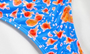 Detail shot of royal blue floral bikini fabric with precision double-needle stitching