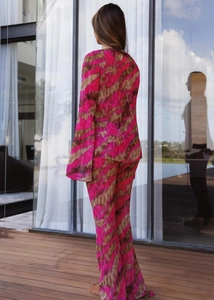 Rear view of fashion two-piece set featuring abstract print top and wide-leg trousers