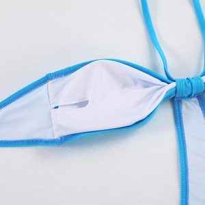 Detail of light blue swimsuit lining with built-in breast pad slot and neat stitching
