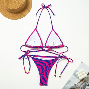 Detail of zebra print bikini with gold bead accents and removable pads for women