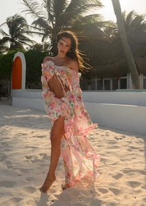 Detailed view of floral two-piece beach set featuring delicate ruffles and sheer fabric