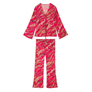 Flat lay of pink and tan animal print two-piece chiffon set with tie-up top and trousers
