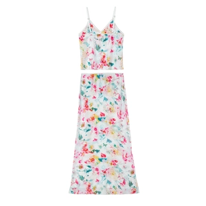 Detail of floral mesh crop top and skirt set with vibrant tropical print patterns