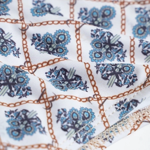 Detail of vintage floral print fabric with durable double-needle stitching on bikini