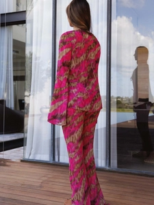 Pink and tan abstract print chiffon two-piece set with long flare sleeves and matching trousers