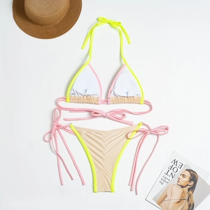 Detailed flat lay of a color-block bikini with ruched back and side-tie bottoms