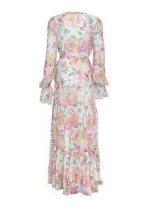Detail view of the back of a floral chiffon maxi dress with tiered hem and ruffle cuffs