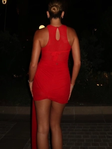 Sultry red halter neck mini dress with side drapes and back cutout detail for beach party
