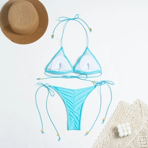 Detail view of light blue bikini top with removable pads and gold bead accents