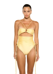 Detail of yellow one-piece swimsuit featuring front metal ring, cutout, and gold butterfly charm