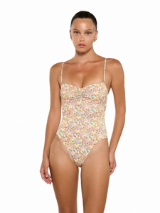 Floral one-piece swimsuit with slim straps and vintage flower print on a light yellow base