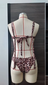 Rear view of leopard print bikini with elegant bow tie-back and secure stitching