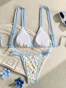 Two-piece bikini set with blue plaid straps and tropical fruit print high cut bottoms