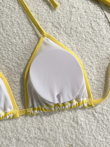 Three-piece striped yellow bikini set with inner padding and elastic hem details