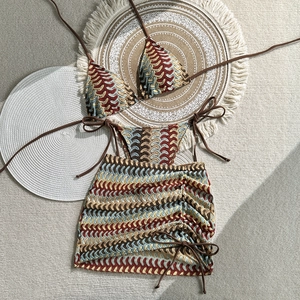 Detailed macro view of crochet knit pattern and chevron texture on 3-piece bikini set
