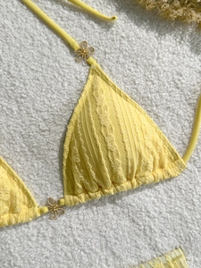 Three-piece solid yellow bikini with lace hollow texture and gold floral metal buckle details