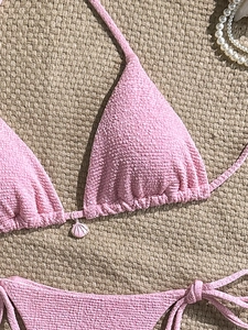 Pink textured bubble fabric bikini set with shell pendant and pearl detail