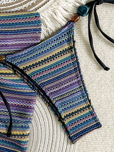 Bohemian striped knit bikini bottom with side ties and colorful bead accents for beachwear
