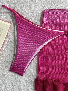 Three-piece pink gradient mesh bikini with textured fabric and ruffle detail for beach vacation