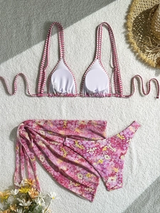 Three-piece floral bikini set for women with matching sarong and elegant sun hat decor