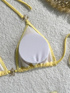 Yellow three-piece bikini top with golden flower buckles and removable soft padding