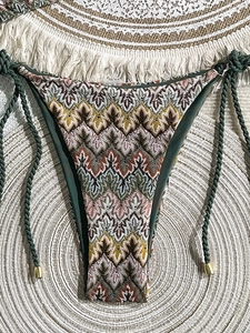 Bohemian knit bikini bottoms with colorful chevron pattern and green braided side ties